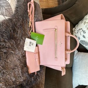 Pink leather Kate Spade Satchel/crossbody handbag. I used once. Kept covered.